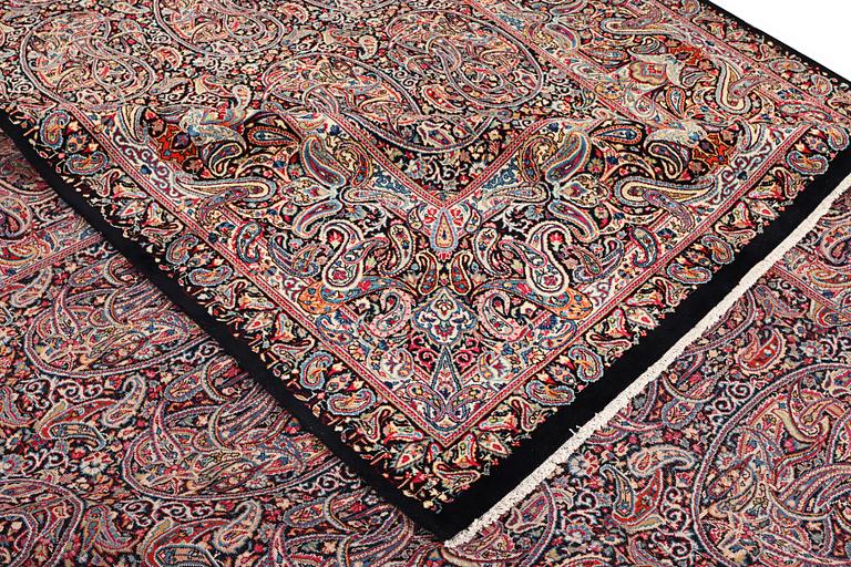 A Boteh pattern Kerman carpet, c. 475 x 342 cm.