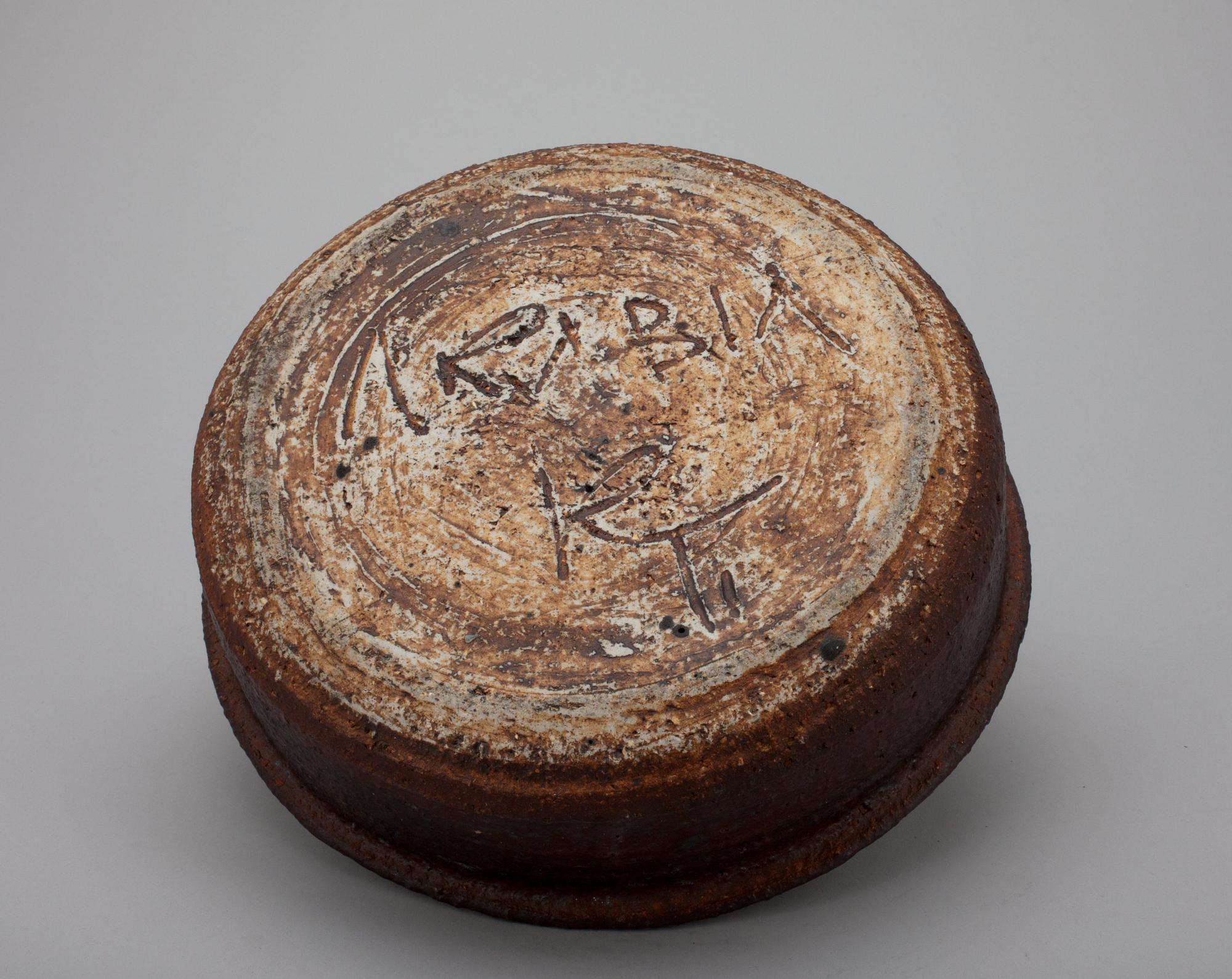 A CERAMIC CANDLESTICK.