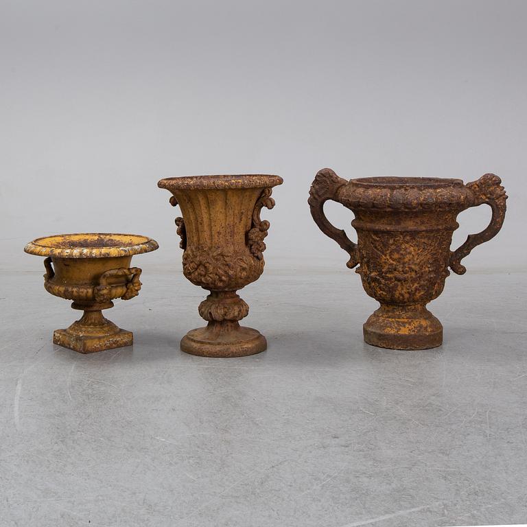 Two 19th century cast iron urns.
