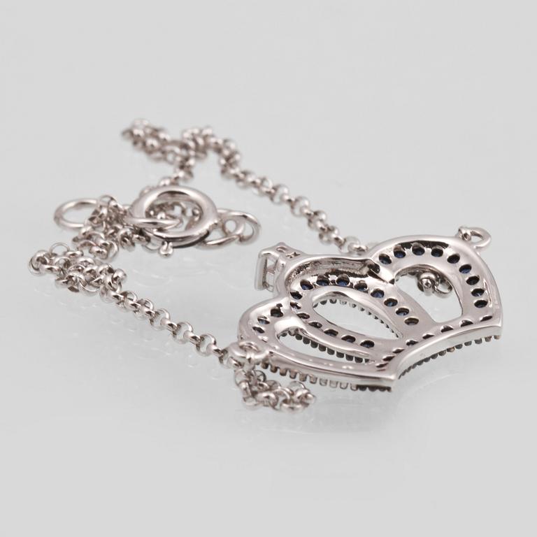 ARMBAND, 18K vitguld med briljantslipad diamant ca 0.02 ct samt fasettslipade safirer ca 0.19 ct. Vikt 1,8 gram.