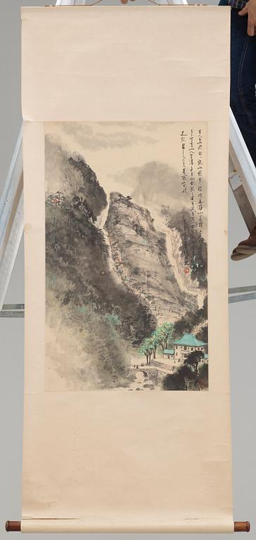 Zhang Renzhi, A hanging scroll of a rocky landscape with a river valley and house, signed.