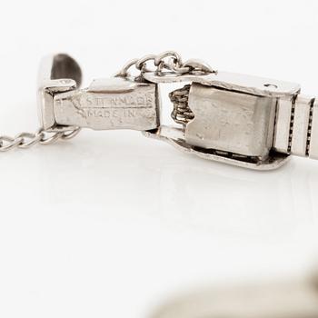 Smyckesur/Aftonklocka, boett 18K vitguld med diamanter.