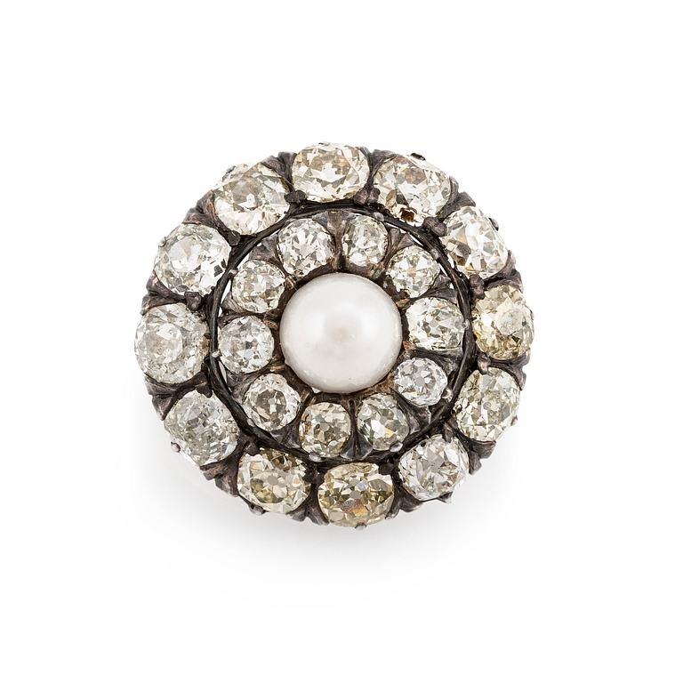 A silver and gold brooch, with cushion-cut diamonds and a pearl.