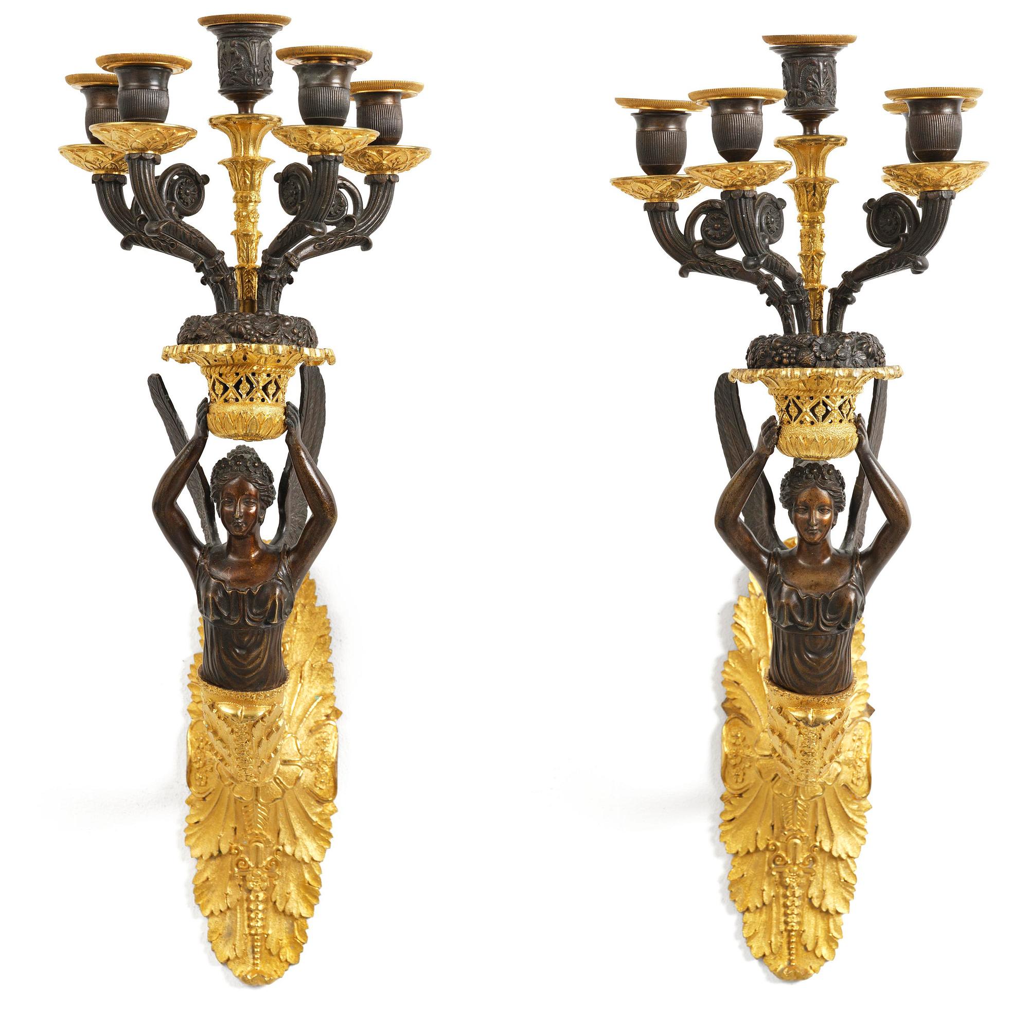 A pair of French Empire five-branch gilt and patinated bronze appliques, first part 19th century.