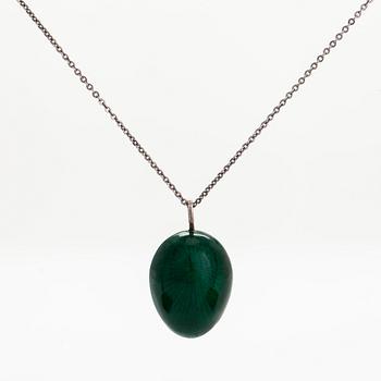 A sterling silver and enamel egg pendant. Tillander, Helsinki.