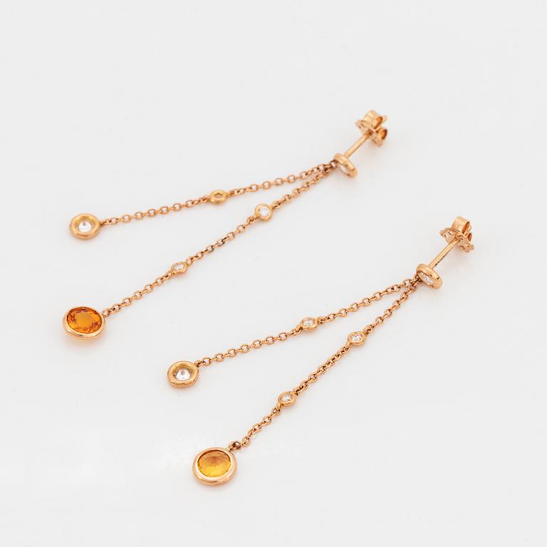 Yellow sapphire and brilliant-cut diamond earrings.