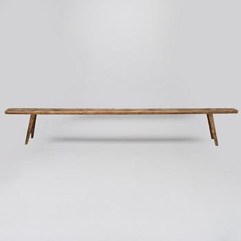 A folk art bench, circa 1900.
