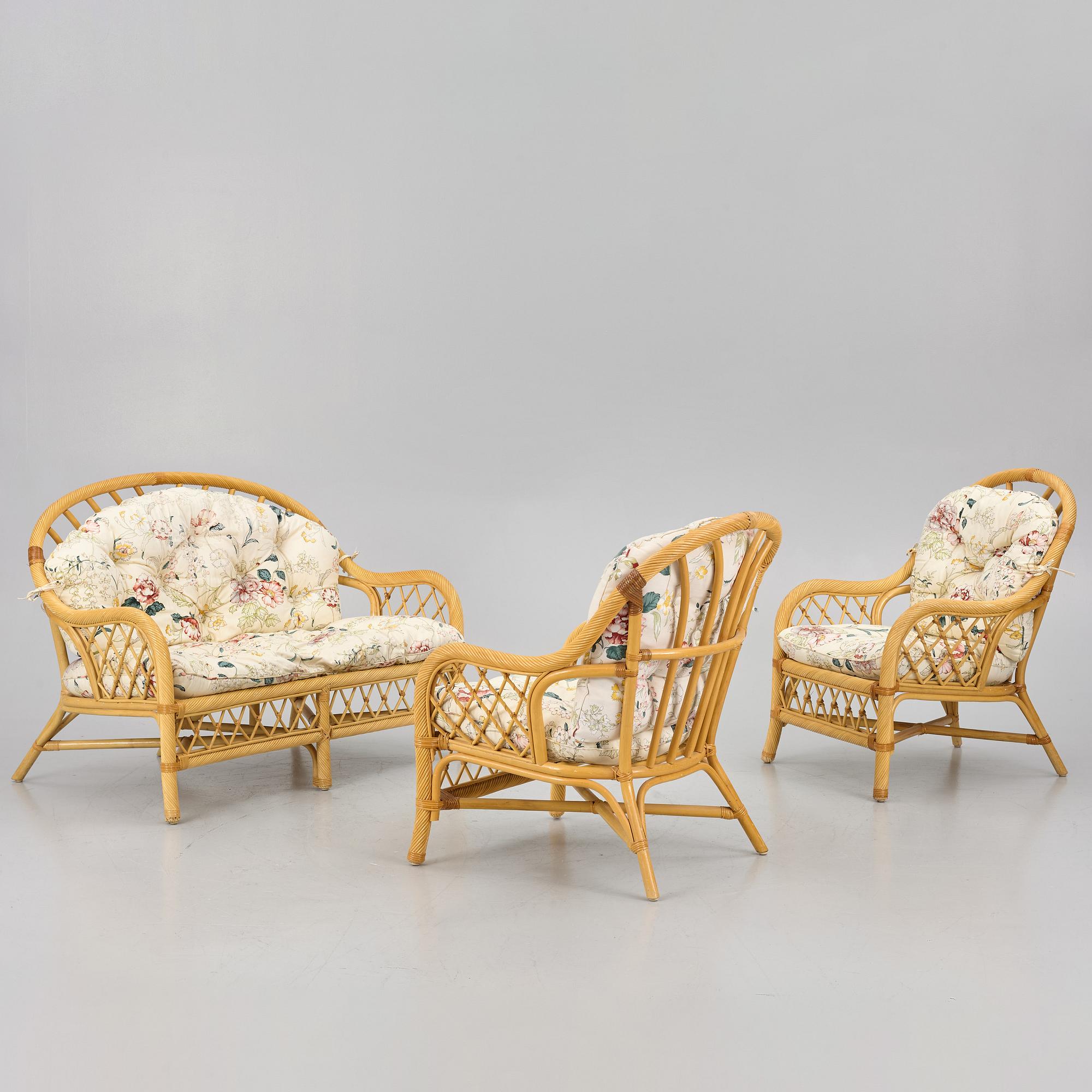 A rattan sofa and two armchairs, later part of the 20th century.
