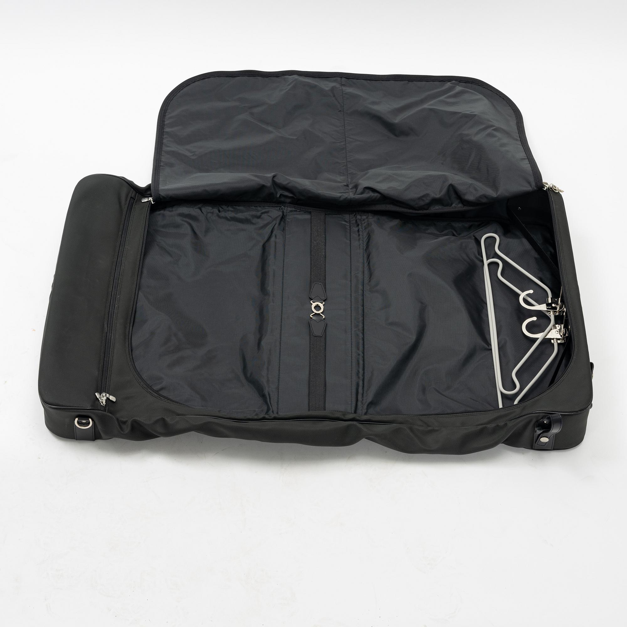Louis Vuitton, a green canvas and Taiga garment bag.