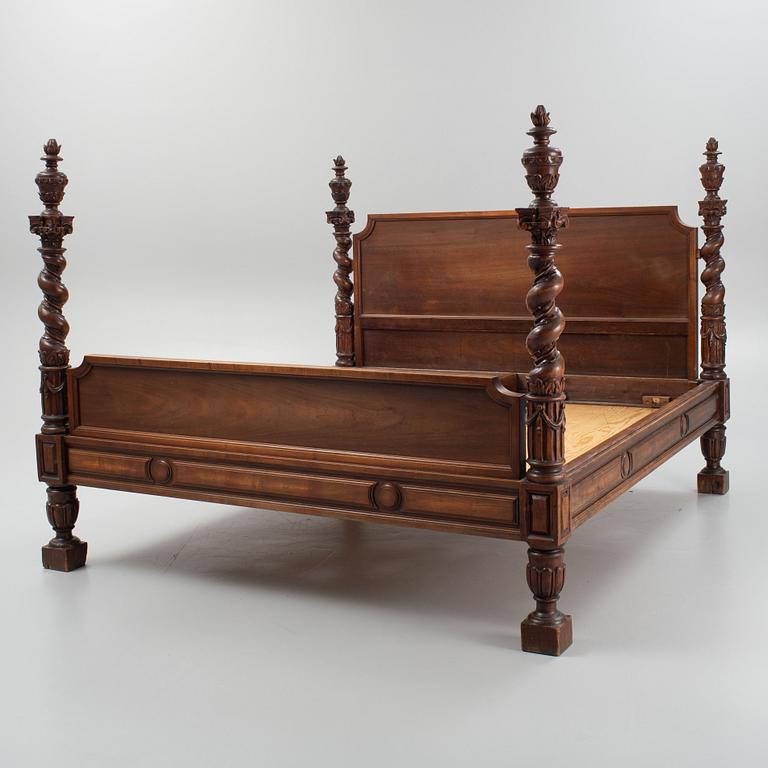 A carved Baroque style bed, early 20th Century.