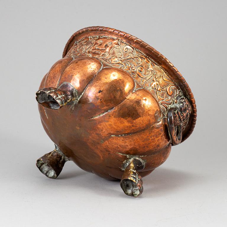 A 19th century copper champagne cooler.