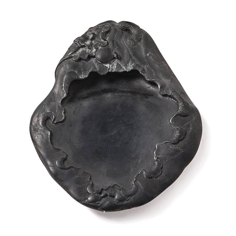 A lotus leaf shaped ink stone, Qing dynasty.