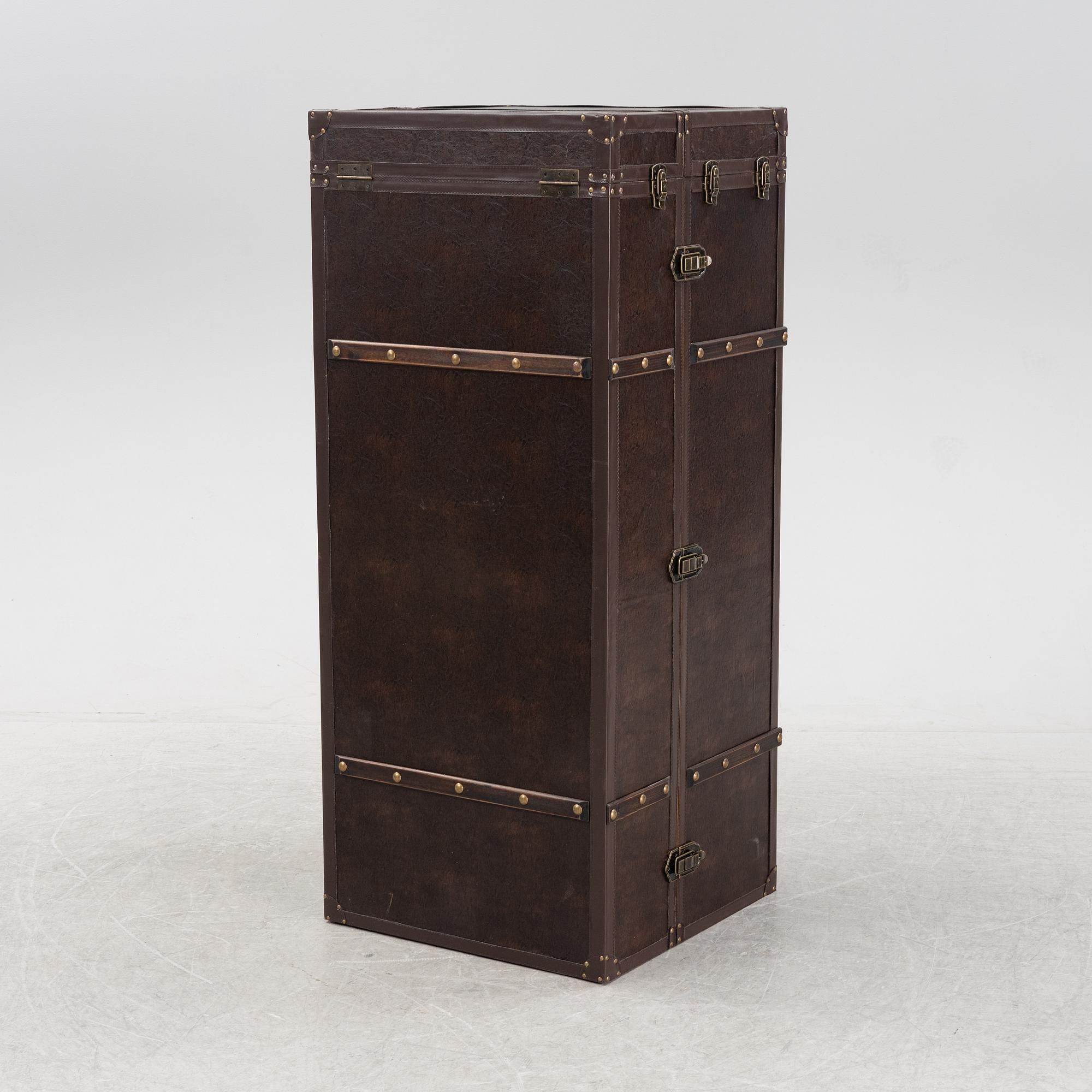 A leather suitcase-shaped bar cabinet.