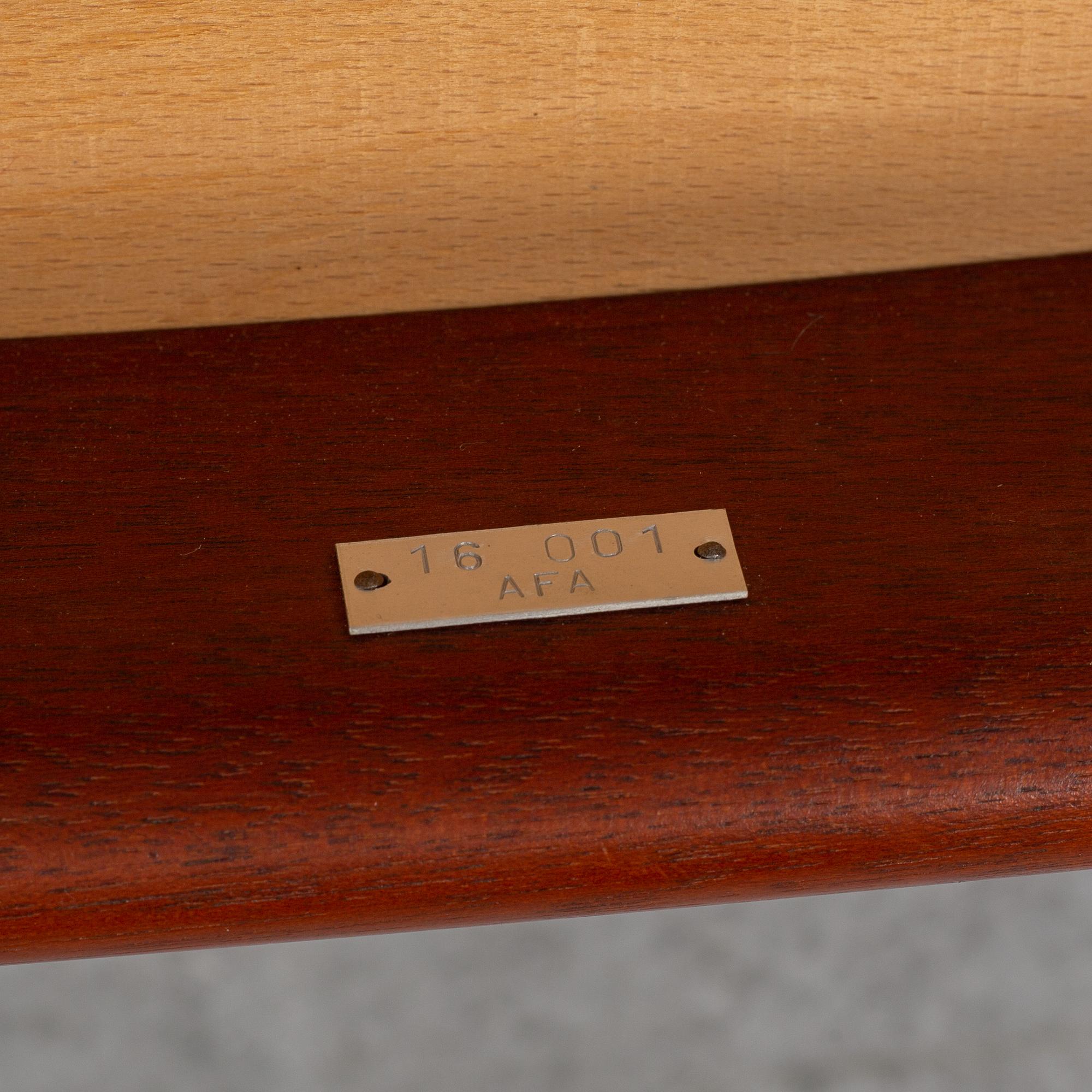 A teak armchair by Hans J Wegener for Johannes Hansen.