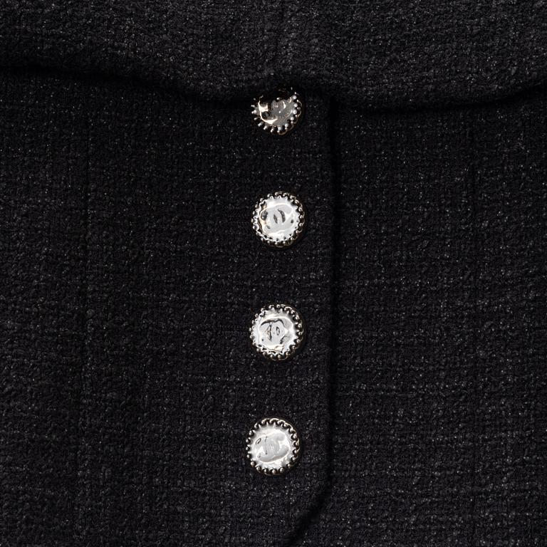 Chanel, A black bouclé jacket, size 34.