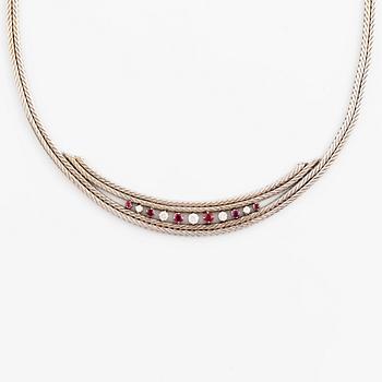 An 18 white gold necklace set with round brilliant-cut diamonds and rubies.