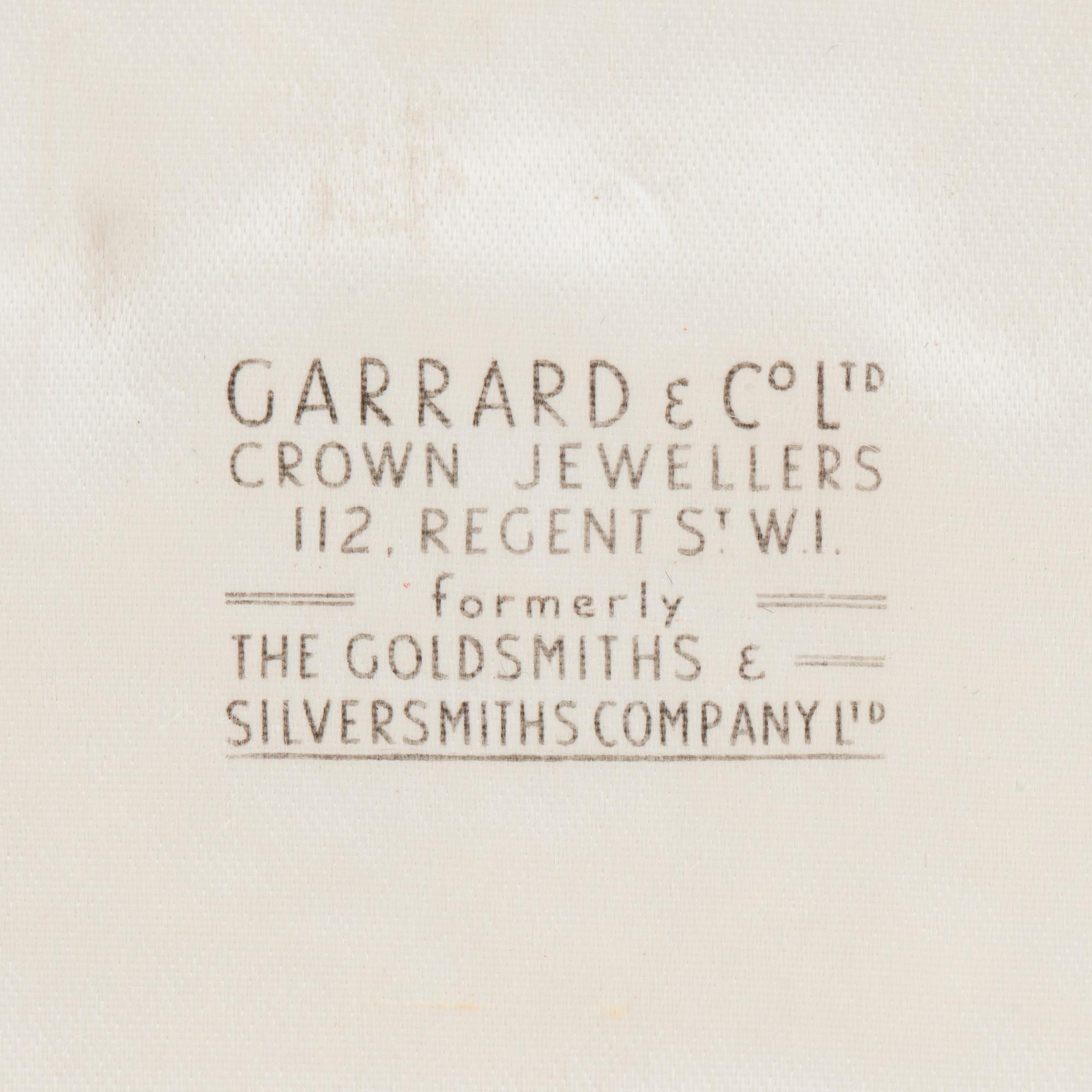 A diamond and sapphire set, probably Garrard & co. The set can be worn as a necklace, earrings, double clip or brooch.