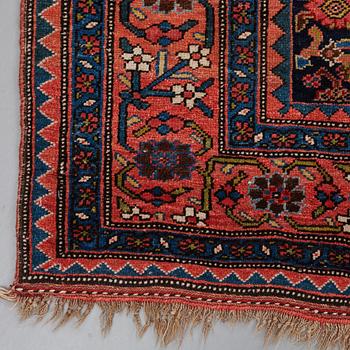 A CARPET, an antique Bidjar kelly, ca 587 x 230 cm.