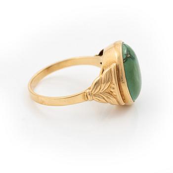 18K gold ring with green stone.