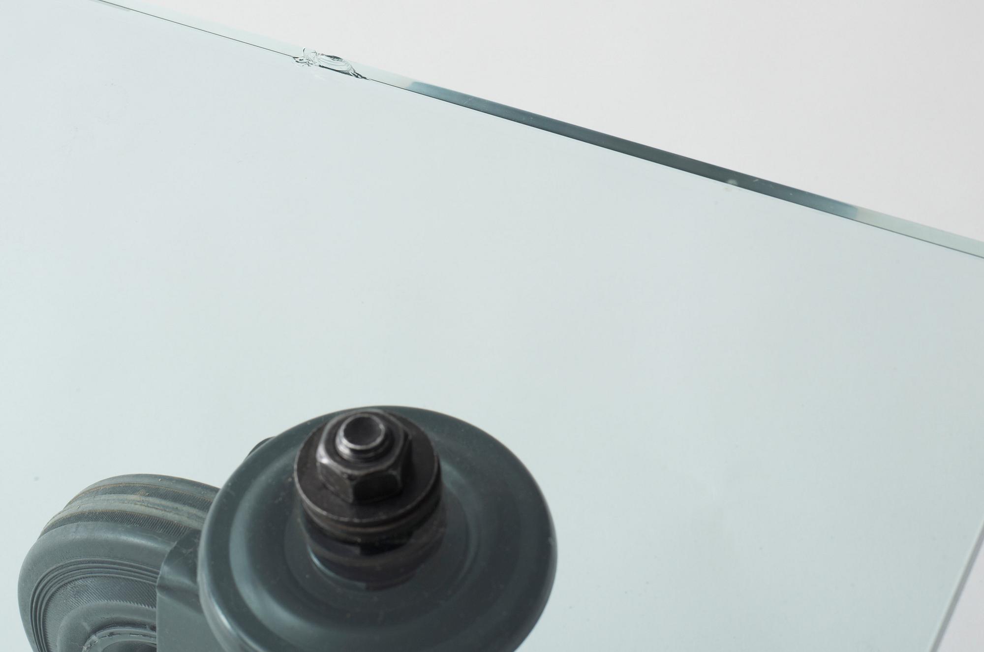A Gae Aulenti 'Tavola con Ruote' table, Fontana Arte, Italy.