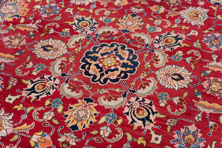 A semi-antique Tabriz carpet, c 358 x 248 cm.