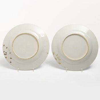 A pair of armorial dinner plates, soft paste, Qing dynasty, 18th century.