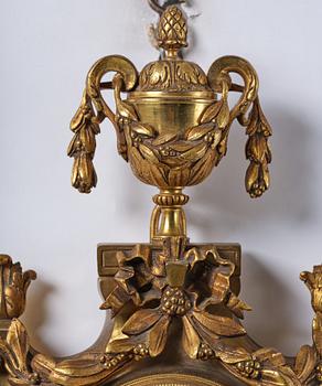 A French  Louis XVI-style wall clock, around 1900.