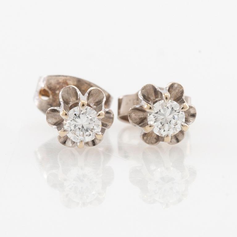 Earrings, a pair of 18K white gold set with round brilliant-cut diamonds.