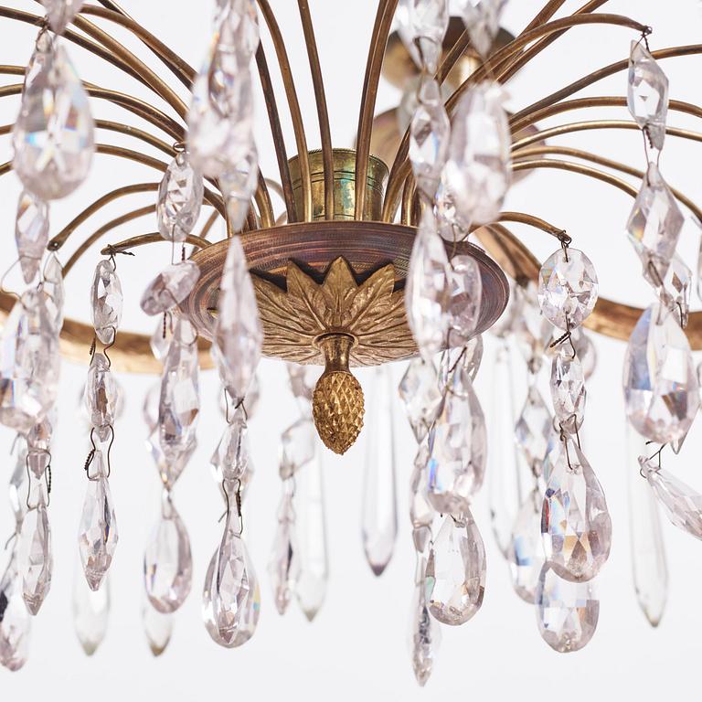 A Gustavian gilt brass and cut glass four-light chandelier, Stockholm, late 18th century.