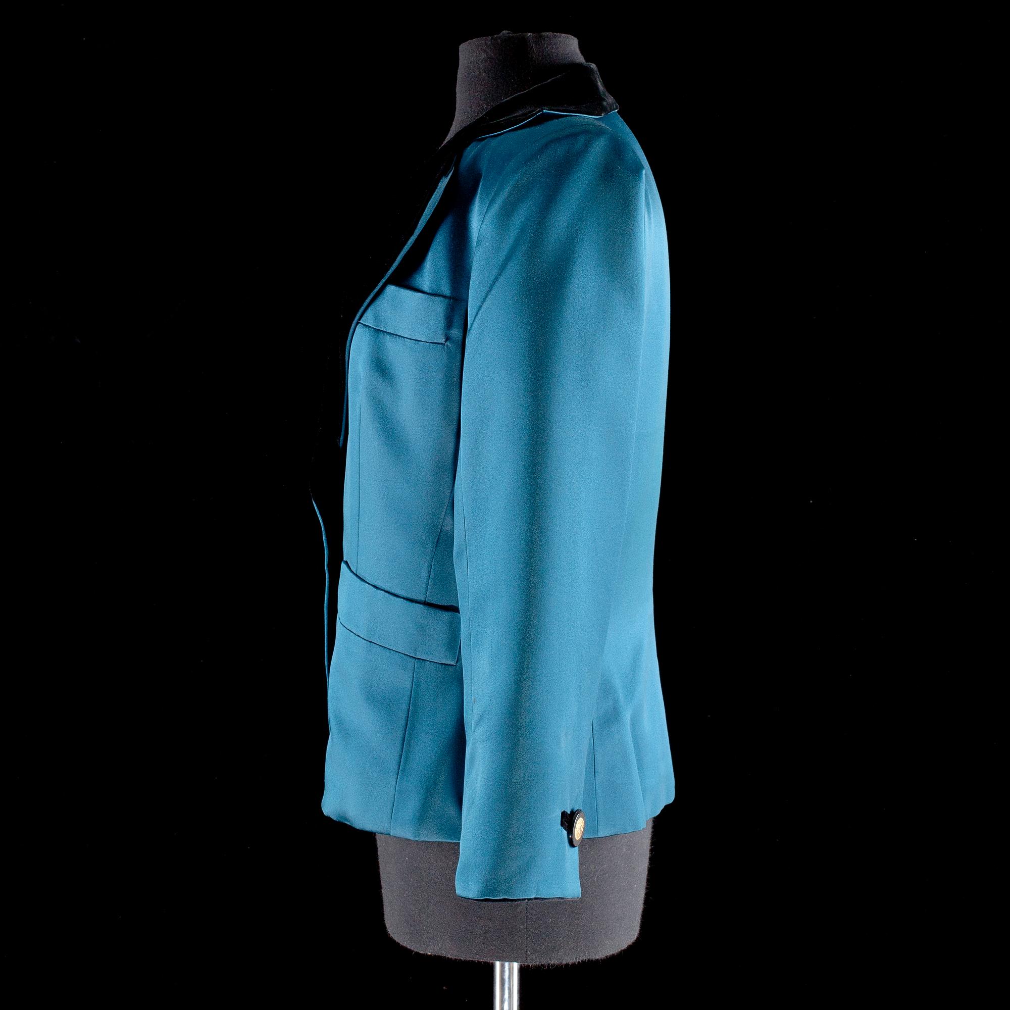 A darkgreen silk and black velvet jacket by Yves Saint Laurent.