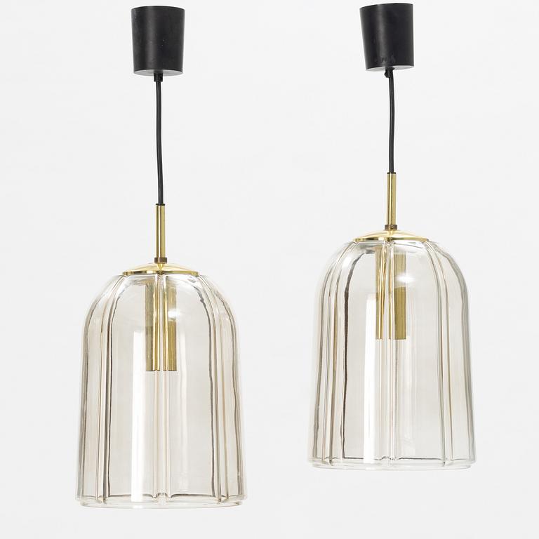 A pair of glass and brass ceiling lights, Glashütte Limburg, Germany.