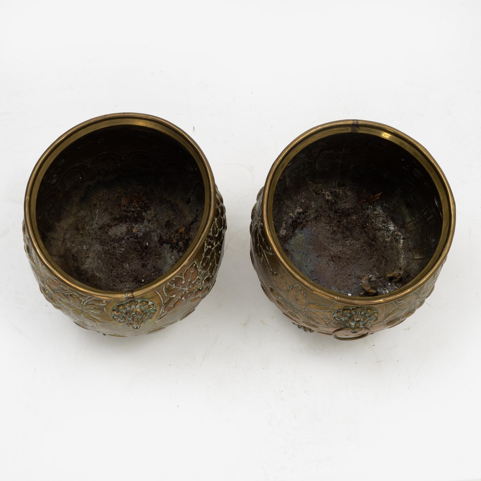 A pair of Baroque style brass plant pots, late 19th Century.