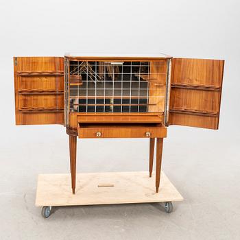A 1950s mahogany bar cabinet.