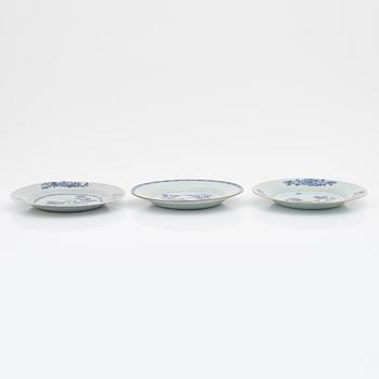A blue and white serving dish and eight odd plates, Qing dynasty, 18th Century.
