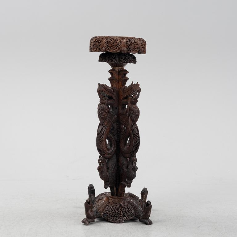 A South East Asian carved wooden piedestal,  20th Century.