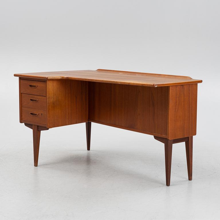 A teak veneered desk, 1950's/60's.
