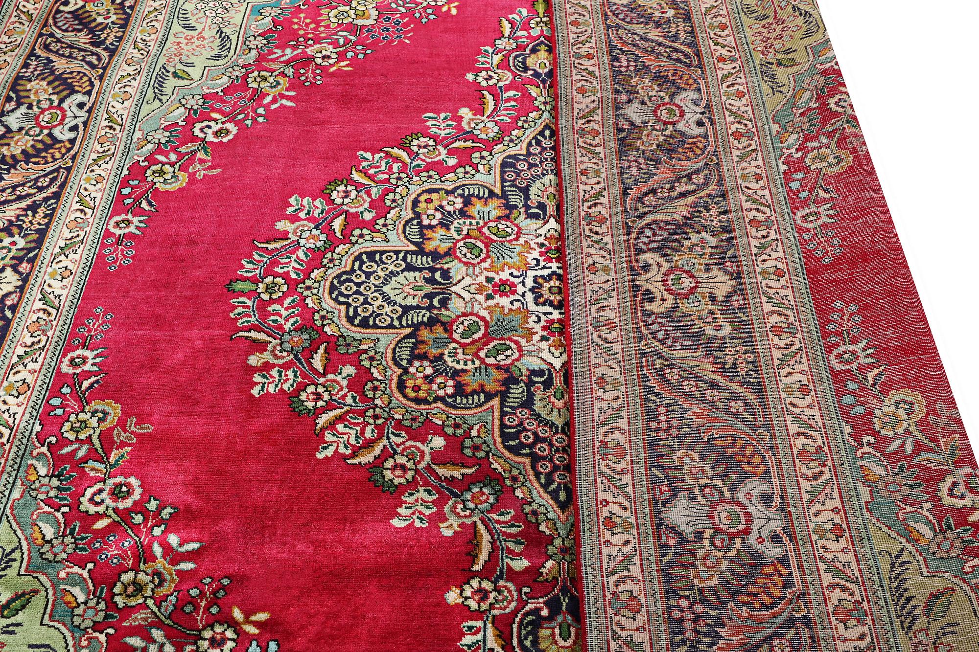 A Tabriz carpet, c. 330 x 250 cm.