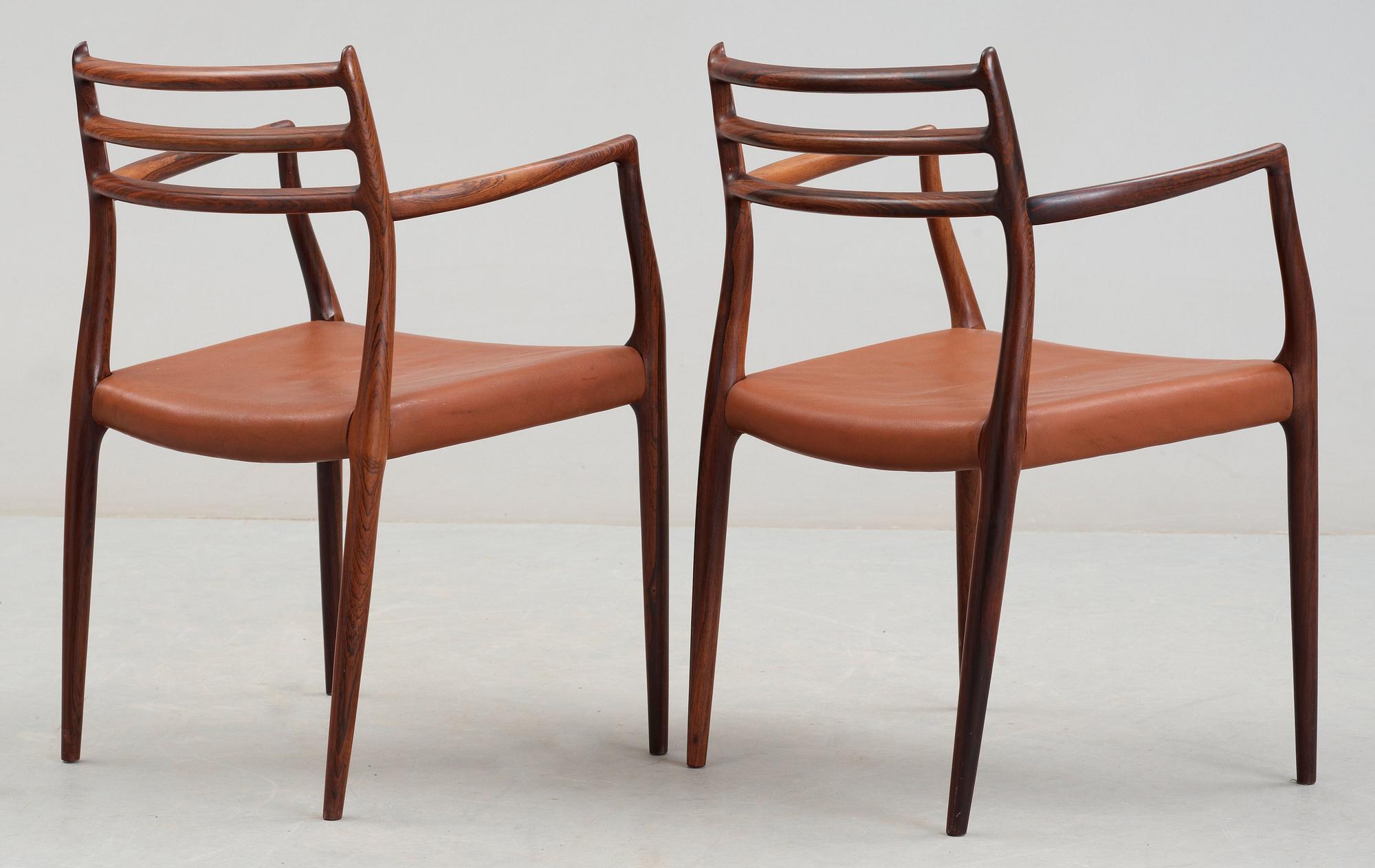 A Niels Ole Møller palisander dining table and and five chairs, J.L. Møller, Denmark 1950's-60's.