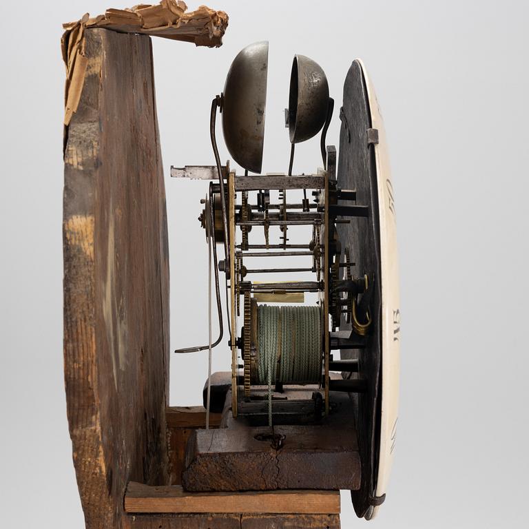 A long-case clock, 19th century.
