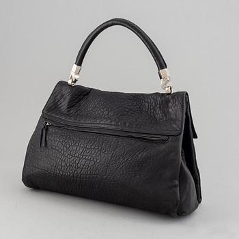 Yves Saint Laurent, a black leather bag.