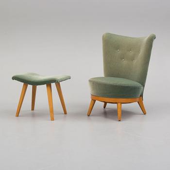 a mid 50th century easy chair with stool.