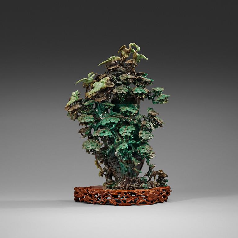 A large, Chinese carved jade pine tree with birds, 20th Century.