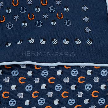 Hermès, a silk tie and two pocket squares.