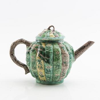 A set of three differently decorated tea pots with covers, Qing dynasty, 18century and 20th century.