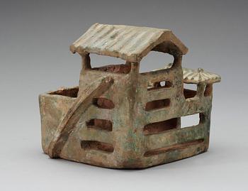 A green glazed pottery model of a house, Han dynasty (206 BC-220 AD).