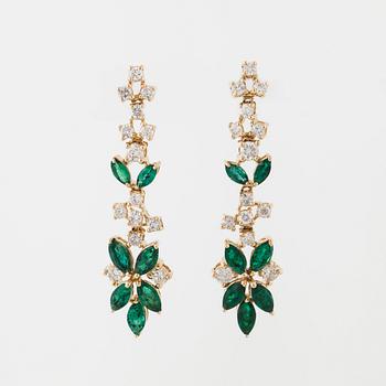 A pair of emerald and brilliant cut diamond earrings.