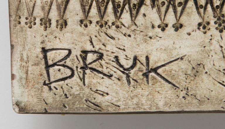 Two piece ceramic relief signed BRYK.