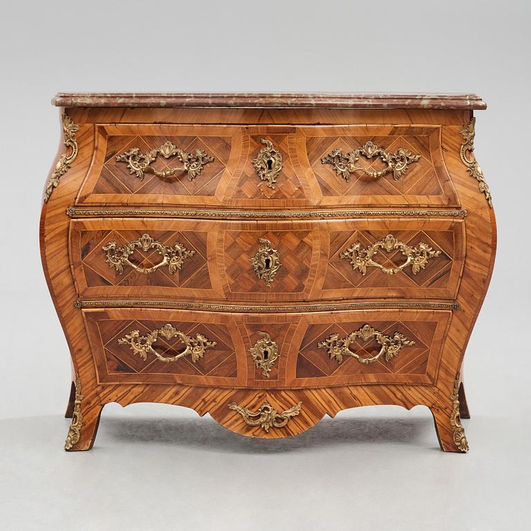 A rosewood-veneered and ormolu-mounted Rococo chest of drawers by J. Wahlbeck (master 1760-1782).