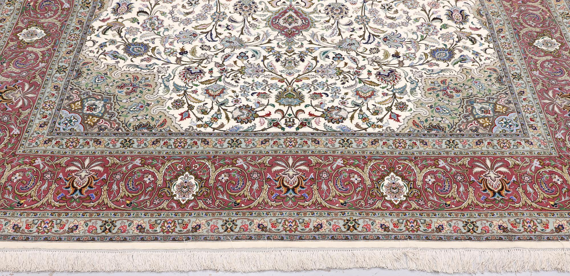 A part silk Tabriz carpet, 310 x 205 cm.