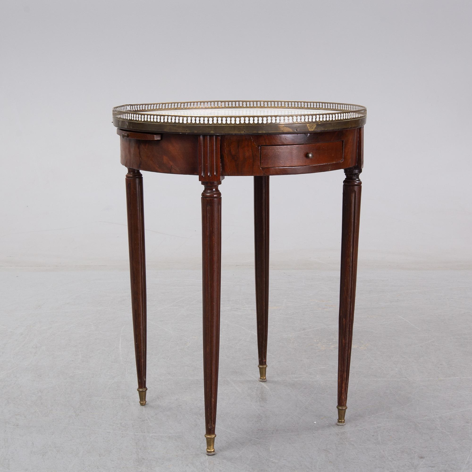A Louis XVI style marble top mahognay table, circa 1900.